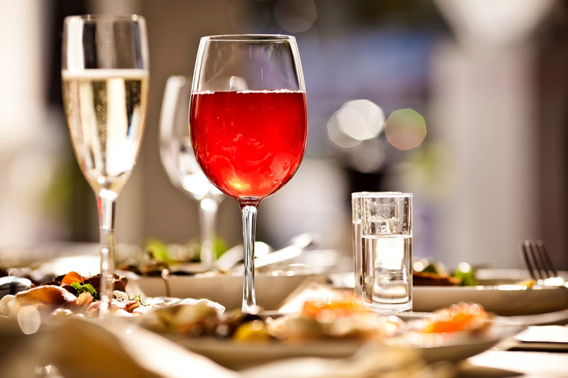 A laid restaurant table with wine glasses set for service