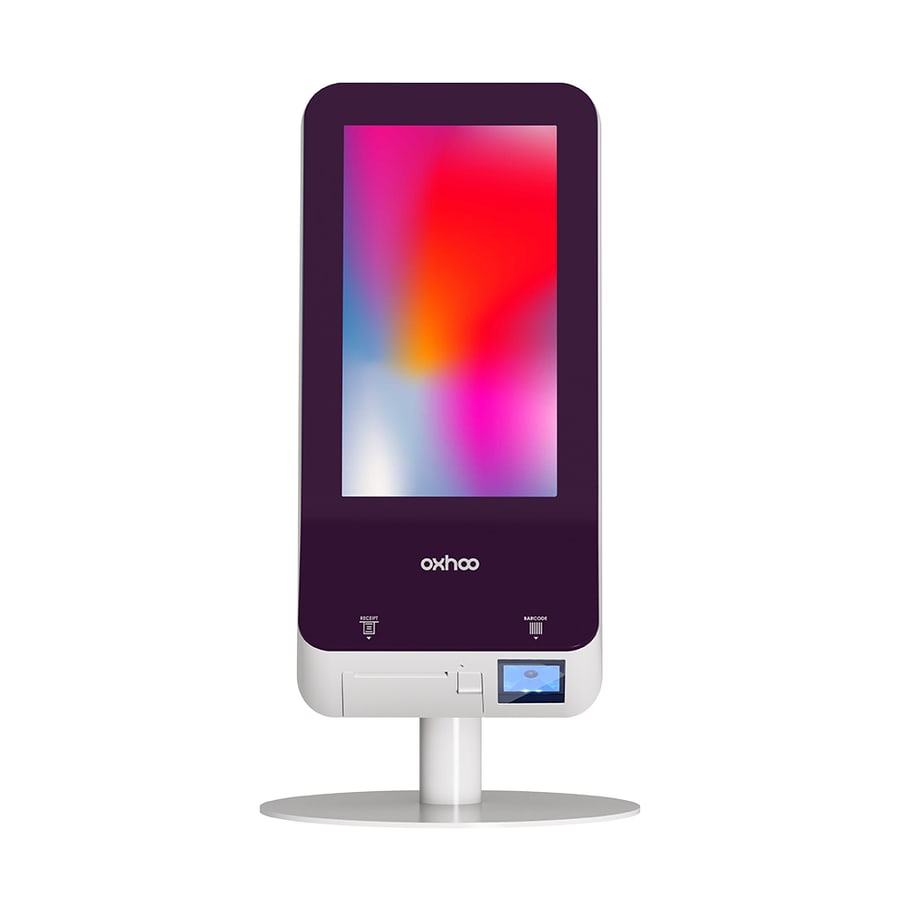 The Oxhoo ELYA 15 self-service kiosk, a small portrait touchscreen on a white countertop stand with a receipt slot and barcode reader below the screen
