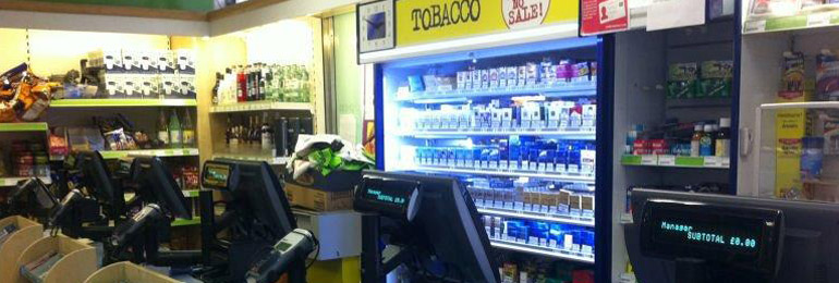 A convenience shop counter with two till terminals in place